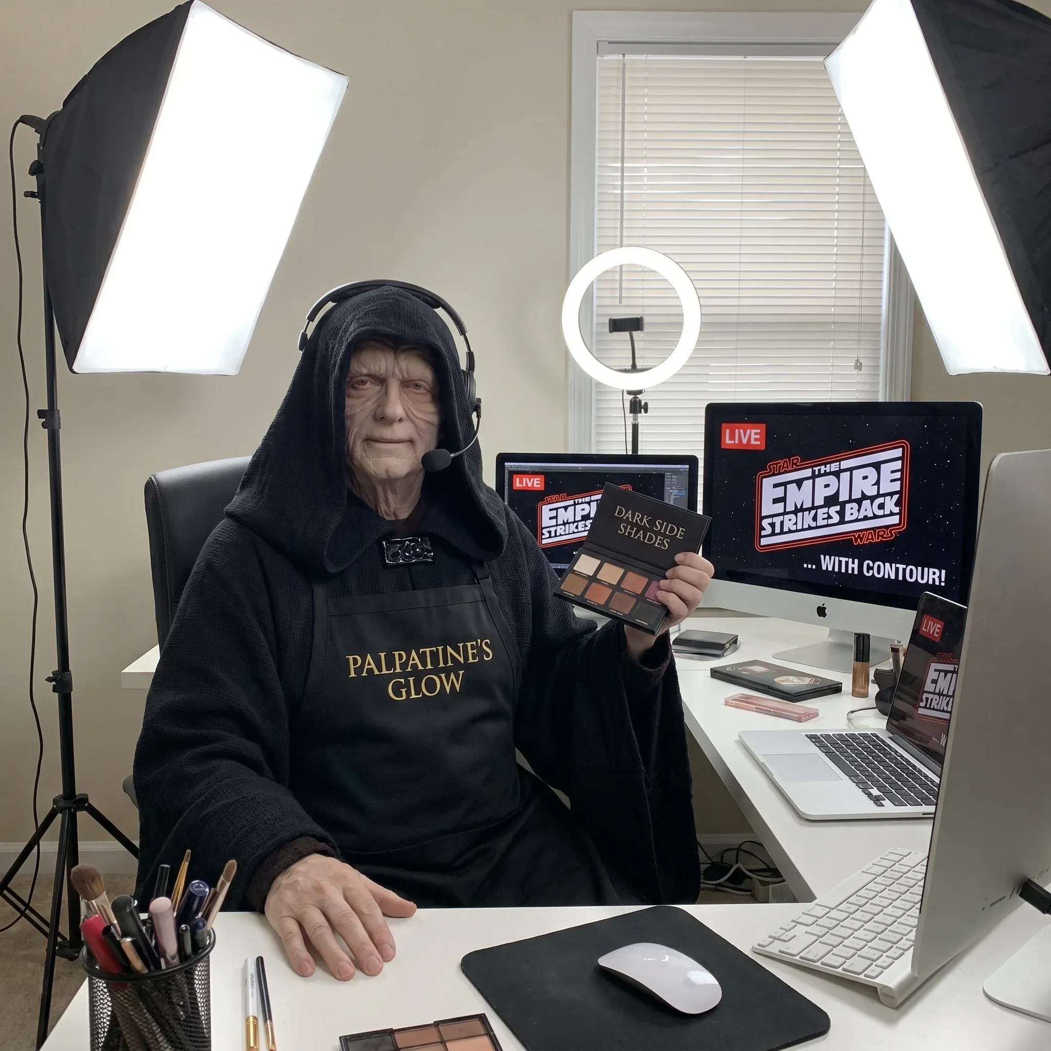 Emperor Palpatine in his black hooded robe livestreaming a beauty tutorial titled Palpatines Glow at a home studio with ring light, makeup palette labelled Dark Side Shades, and an Empire Strikes Back With Contour ad on screen