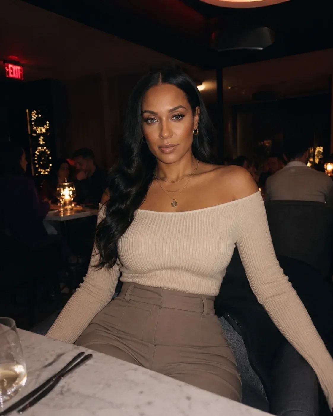 AI-generated nightlife scene of Keisha Binns's AI influencer character on a night out - rooftop bar, late dinner, mirror selfie or candid flash photo